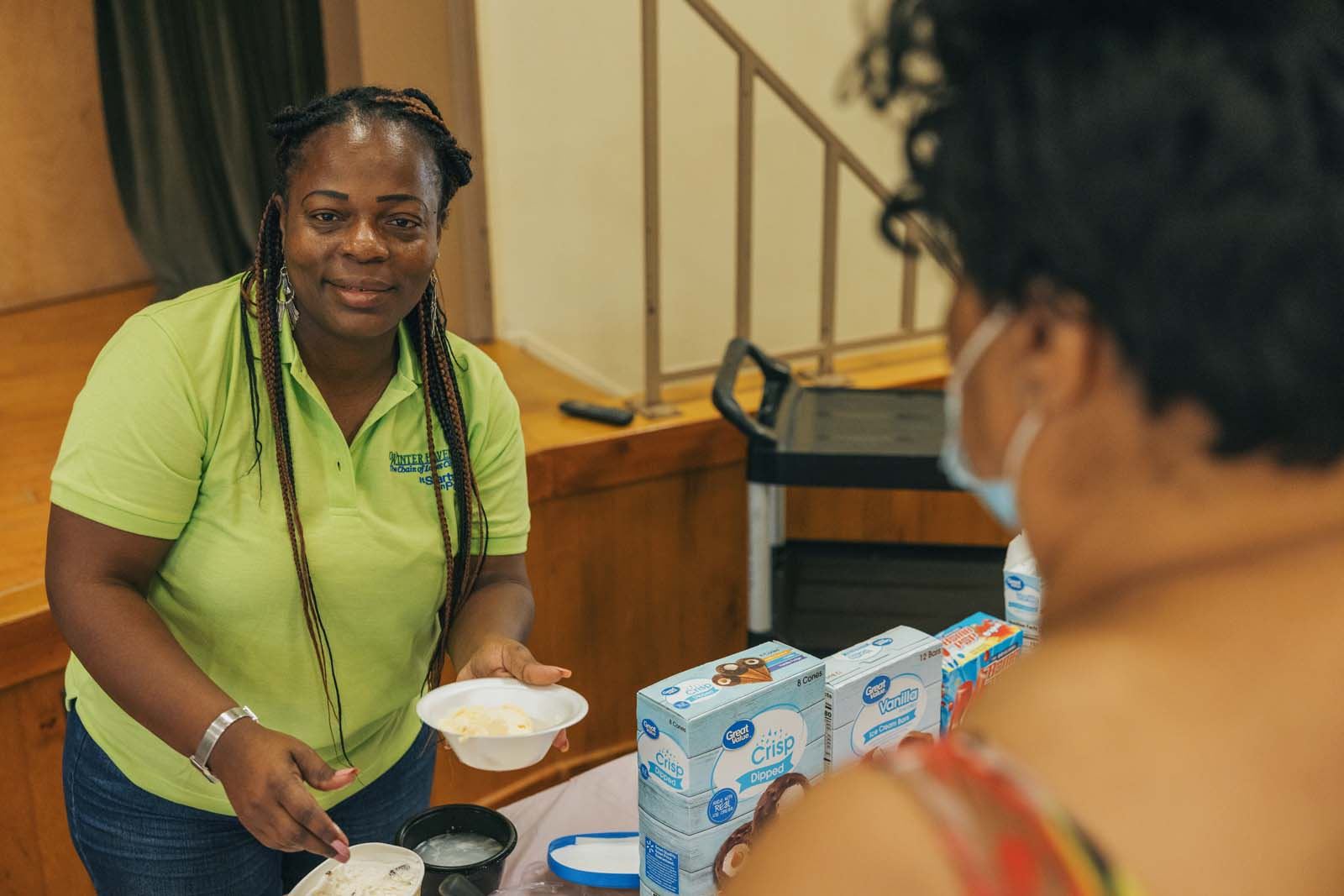 Staff serving ice cream at the Winter Haven Senior Center.