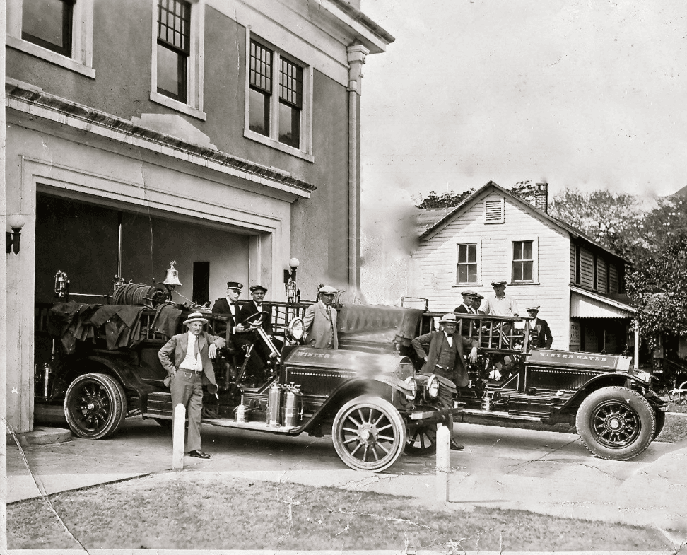 People and Cars in Front of Fire Station